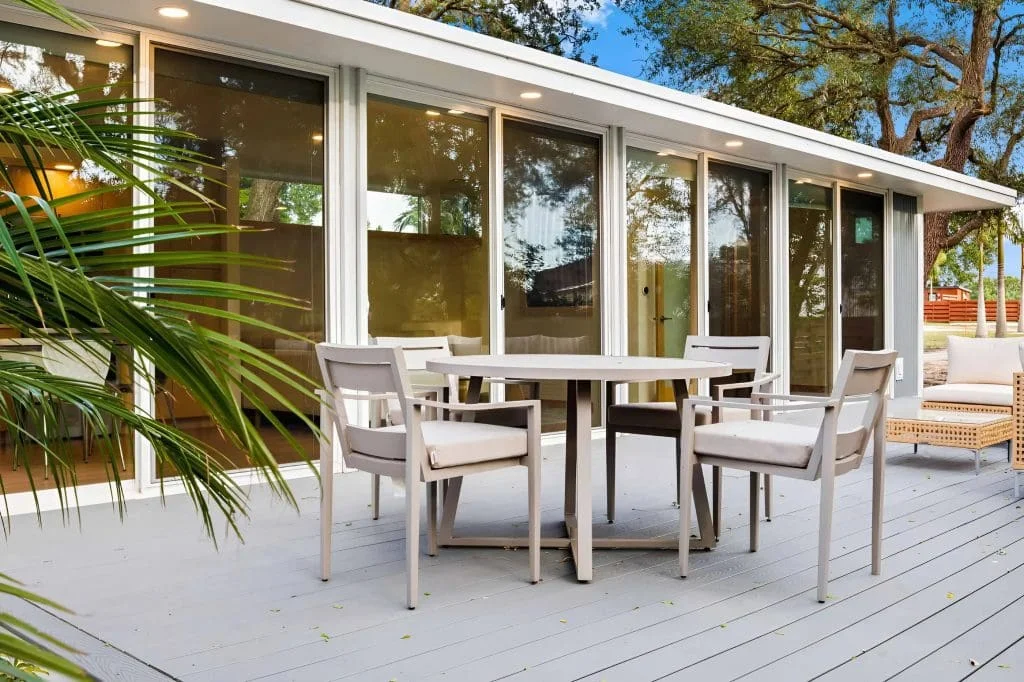 Spacious outdoor deck with dining area and seating for relaxing and entertaining